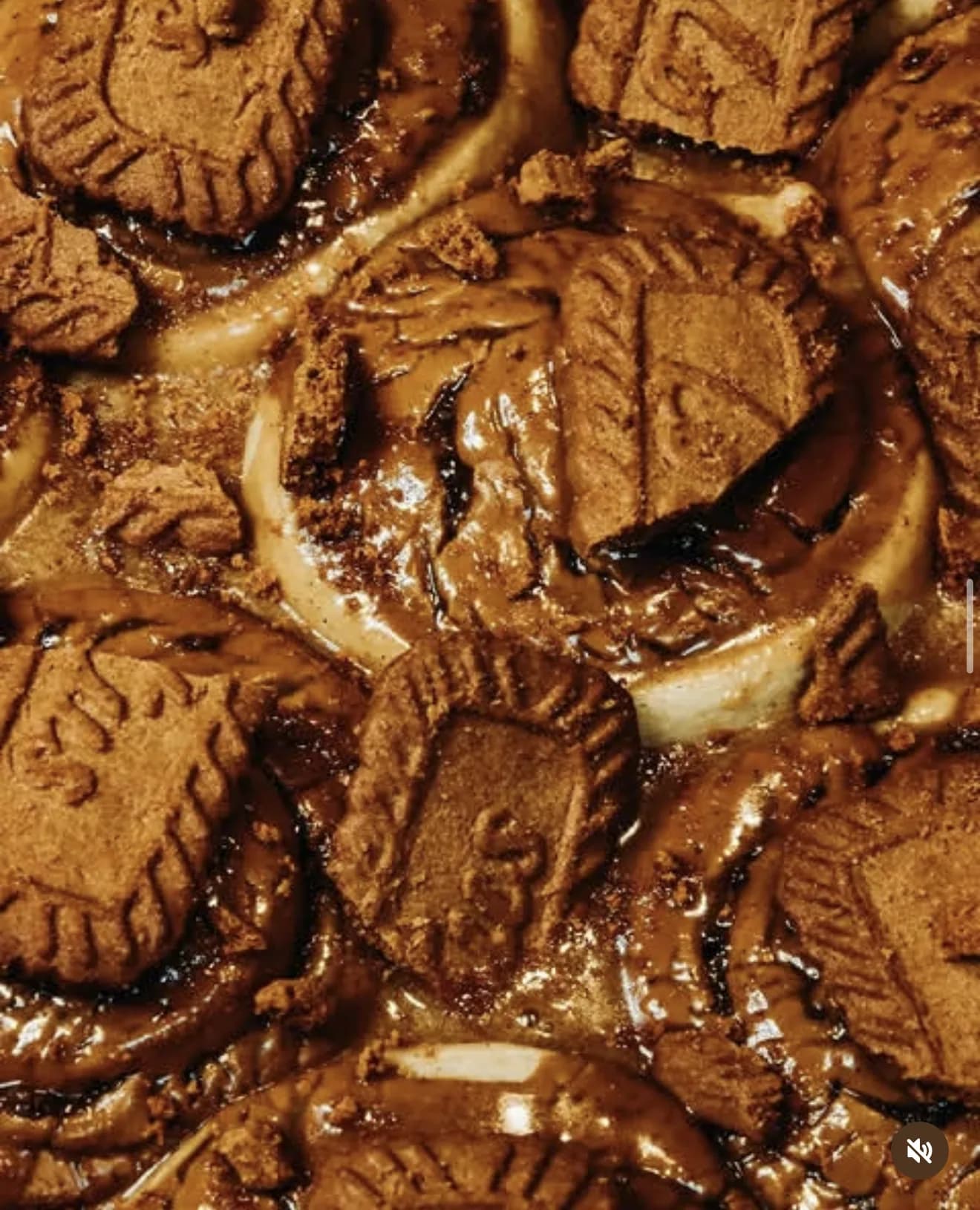 Close-up of Biscoff cookie dessert with caramel drizzle and stamped speculoos cookies