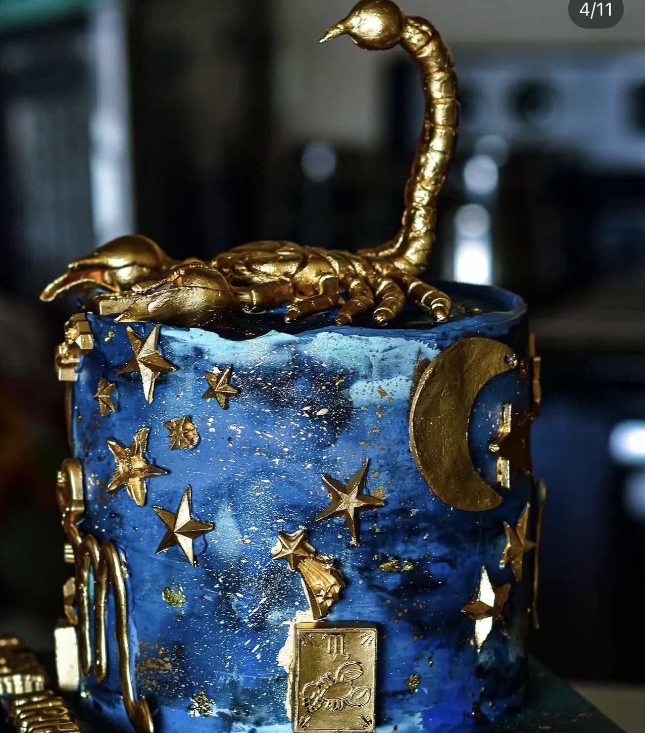 Starry navy Scorpio zodiac cake with sculpted gold scorpion, stars, moon and tarot accents