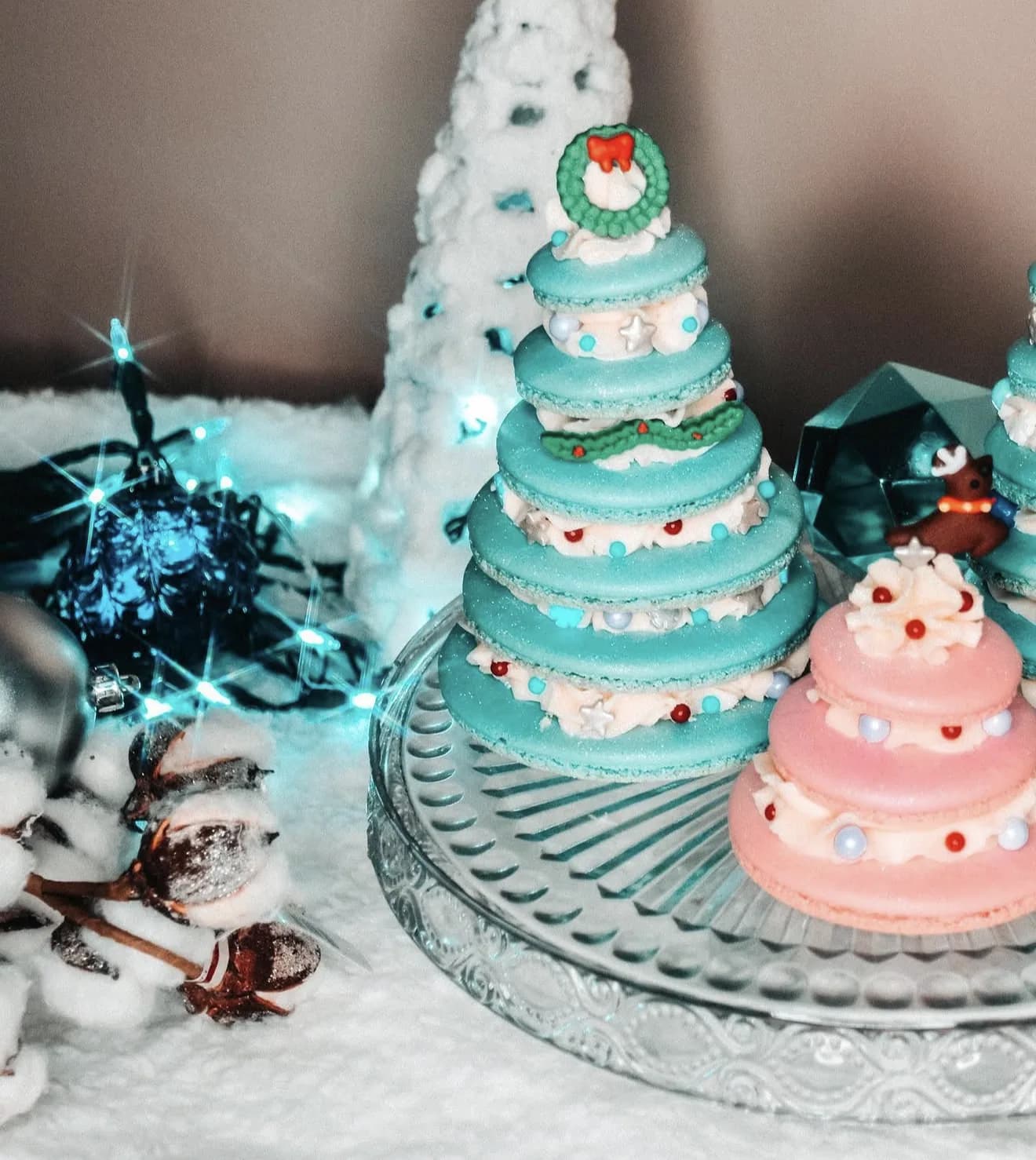 Teal macaron Christmas tree with silver stars snowflakes candy cane topper and blue pearls